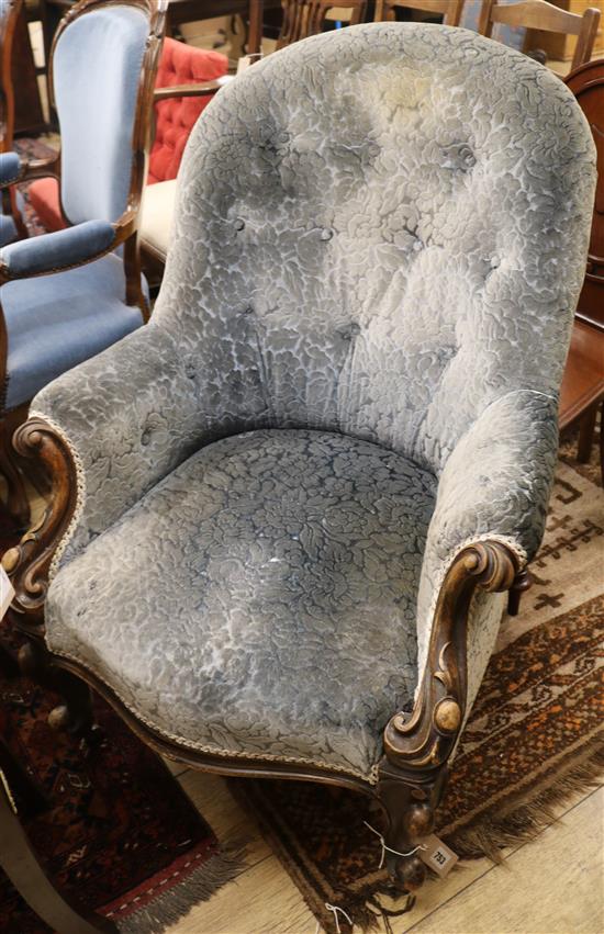 A Victorian spoonback armchair
